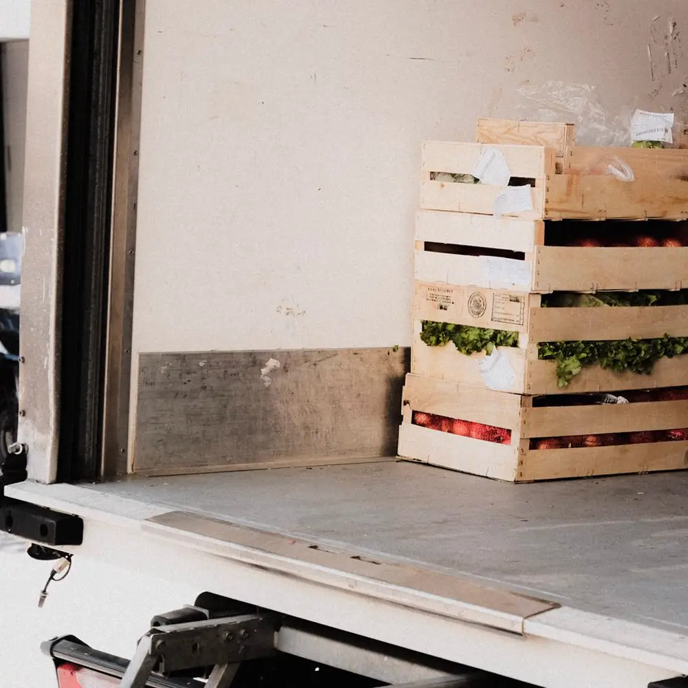 Crates of fresh produce inside a delivery vehicle