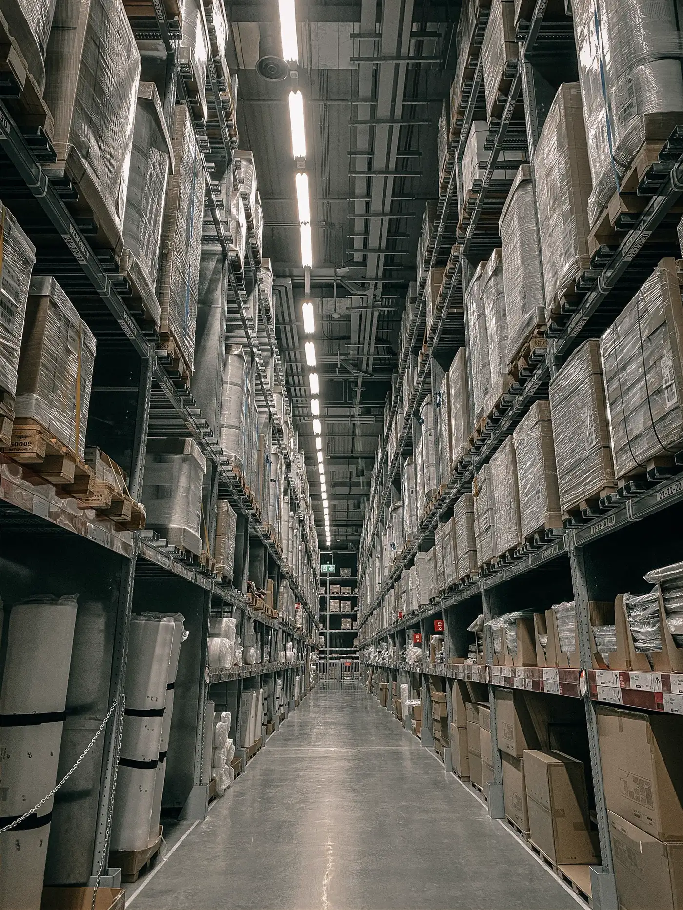 Warehouse aisle with high racking